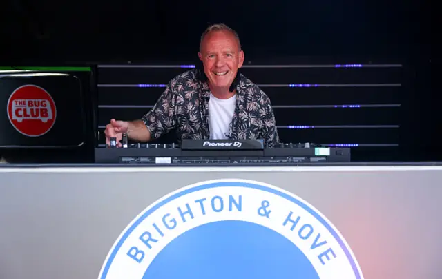 Musician and DJ Norman Cook (Fatboy Slim), poses for a photo outside the stadium