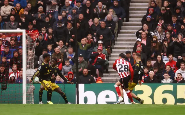 Enzo Le Fee shoots at goal and hits Manchester United's Amad Diallo's hand