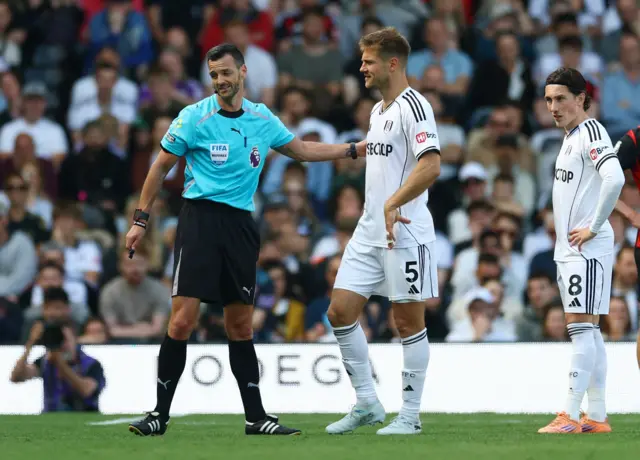 Fulham's Joachim Andersen remonstrates with referee Andy Madley after being shown a red card