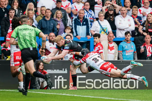 Zach Eckersley dives over for Wigan's third try
