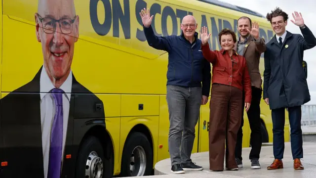Scotland's First Minister John Swinney and then-candidates Stephen Gethins, Heather Anderson and Lloyd Melville launch the Scottish National Party's campaign bus on 18 April 2026 in Dundee, Scotland