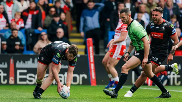 Jack Farrimond scores Wigan's first try against St Helens