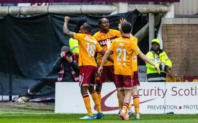 Motherwell's Emmanuel Longelo celebrates with Elijah Just and Tawanda Maswanhise