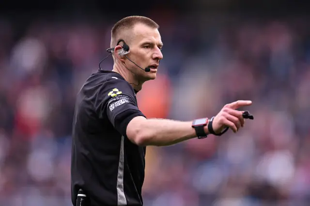 Referee Michael Salisbury gestures