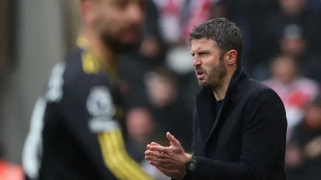 manager Michael Carrick reacts