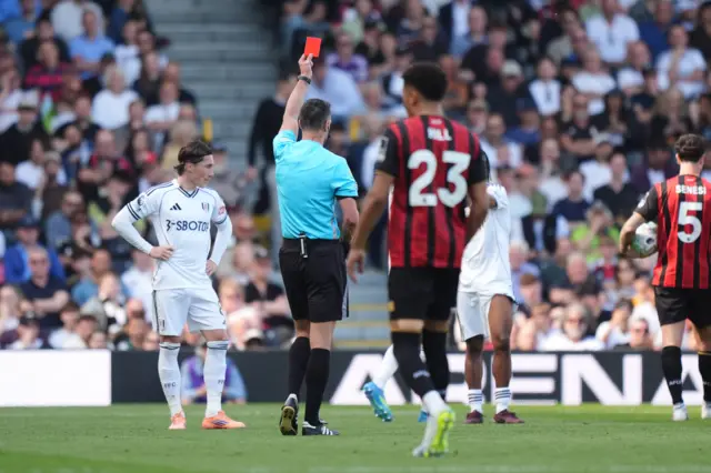 Fulham’s Joachim Andersen (not pictured) is shown a red card by referee Andy Madley