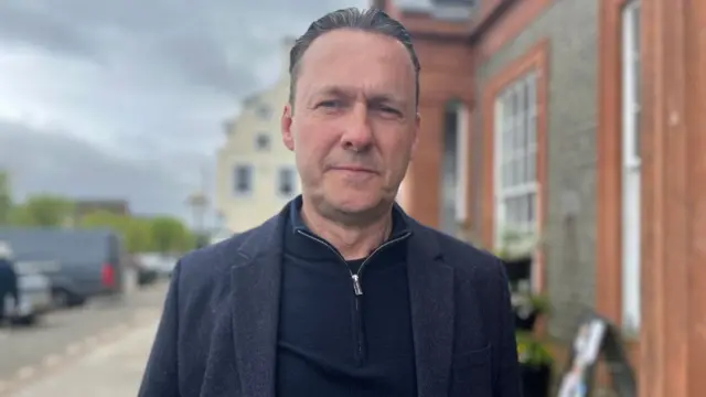 Russell Findlay looking directly at the camera.