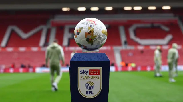 An EFL ball on a stand which reads "EFL play-offs" at the Riverside Stadium