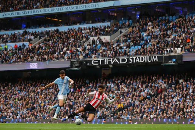 Kevin Schade of Brentford appeals for a penalty from a challenge by Matheus Nunes