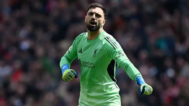 Giorgi Mamardashvili of Liverpool celebrates after Ryan Gravenberch of Liverpool (not pictured) scores his team's first goal during the Premier League match between Liverpool and Chelsea