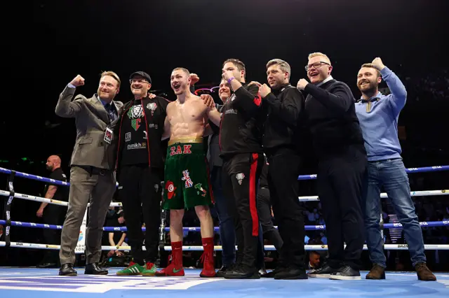 Zak Chelli with his family and coaching team in the ring