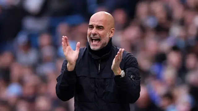 Manager of Manchester City, reacts