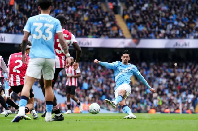 Tijjani Reijnders (right) attempts a shot on goal