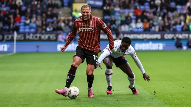 Bradford City's Antoni Sarcevic shields the ball from Bolton Wanderers' Jordi Osei-Tutu