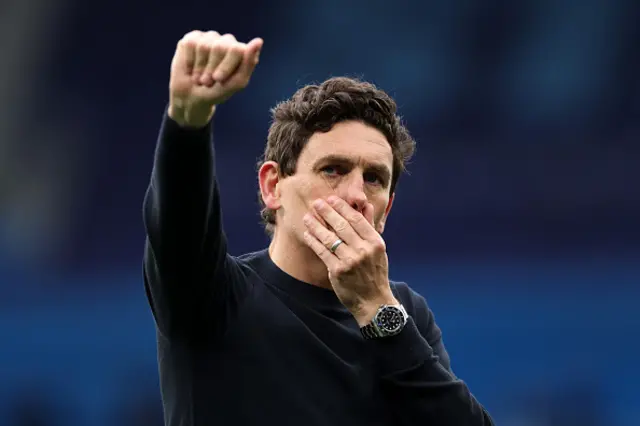 Keith Andrews, Manager of Brentford, acknowledges the fans