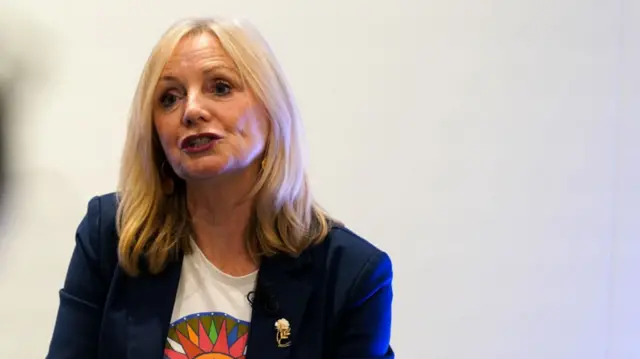 Tracy Babin sat down in a dark blazer and white top