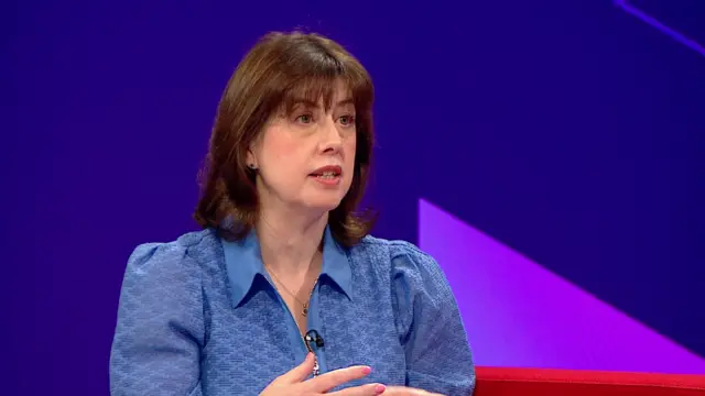 Labour's deputy leader Lucy Powell speaks to BBC Breakfast wearing blue dress with studio background behind her