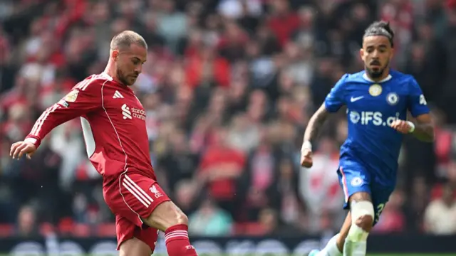 Alexis Mac Allister of Liverpool controls the ball during the Premier League match between Liverpool and Chelsea