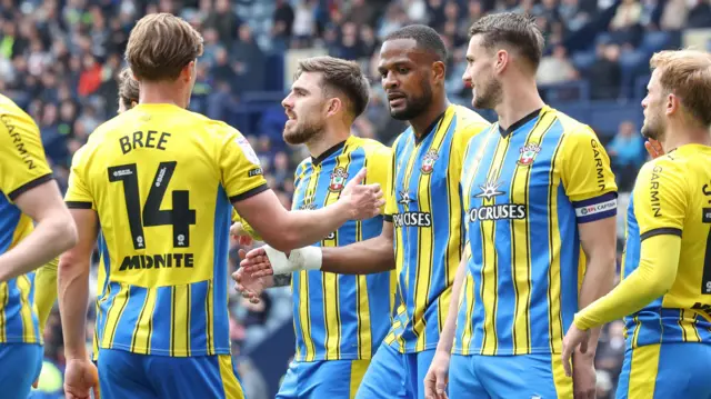 Southampton players celebrate a goal against Preston