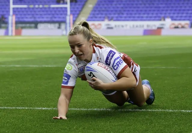 Ellise Derbyshire dives over to score Wigan's first try against York