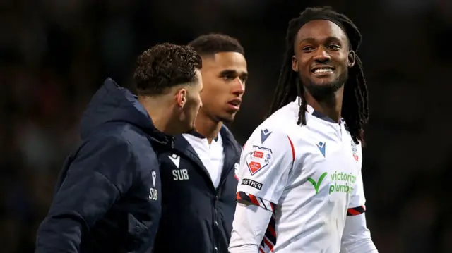 A smiling Ibrahim Cissoko of Bolton Wanderers reacts after the team's victory