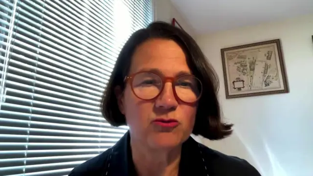 Labour MP Catherine West speaking on her computer during a virtual meeting. She's in a white-walled room, a window behind her to her right