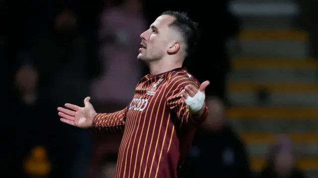 Antoni Sarcevic spreads his arms wide to celebrate his goal against Stockport for Bradford