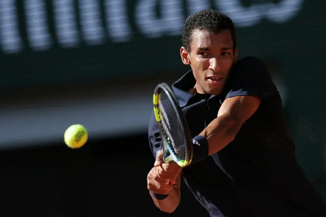 Canada's Felix Auger-Aliassime plays a backhand return