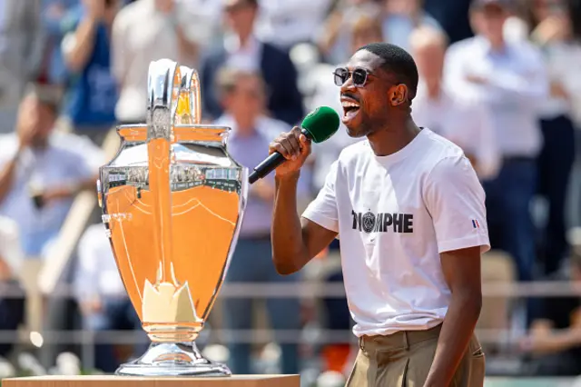Ousmane Dembélé of Paris Saint-Germain shows the Champions League Trophy