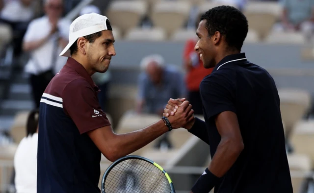 Canada's Felix Auger Aliassime shakes hands with Chile's Alejandro Tabilo after winning their fourth round