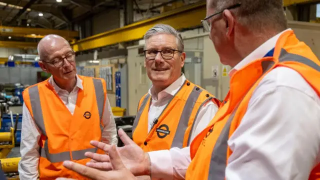 Keir Starmer and Pat McFadden wearing orange high vis jackets
