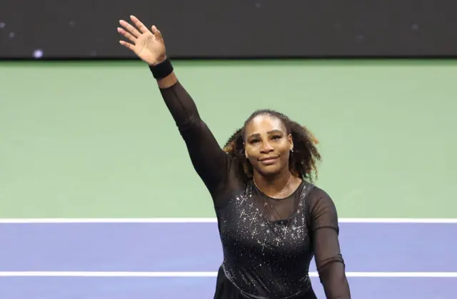 Serena Williams waves her hand