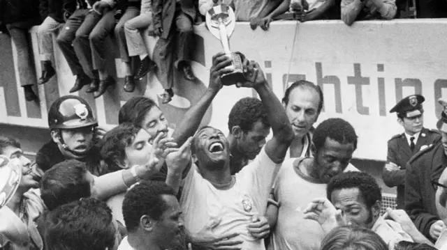 Pele lifting the orignal World Cup trophy in 1970