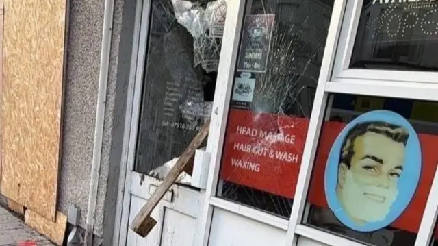 Smashed window of shop