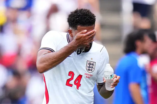 Reece James pours water on his face