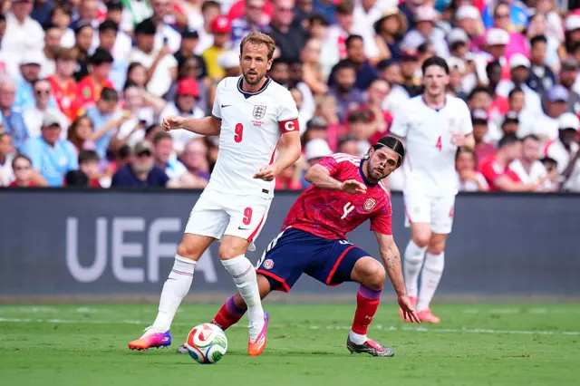 Harry Kane is challenged by Aaron Salazar