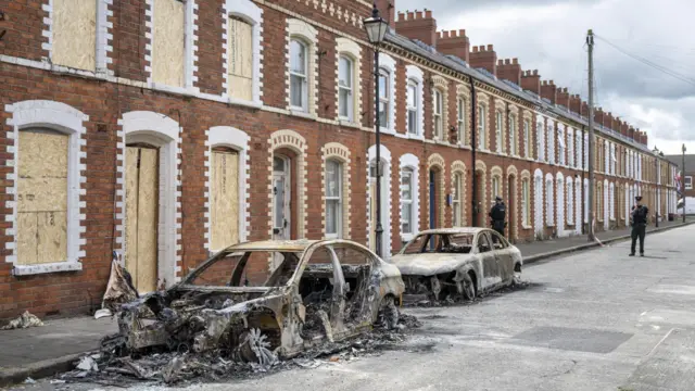 Burnt-out cars are seen on McMaster Street following last night's disorder Belfast, Northern Ireland, 10 June 2026.