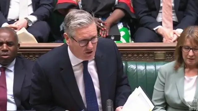 Keir Starmer, wearing a dark suit, speaking in the House of Commons