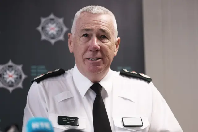 Jon Boutcher mid-speech in uniform