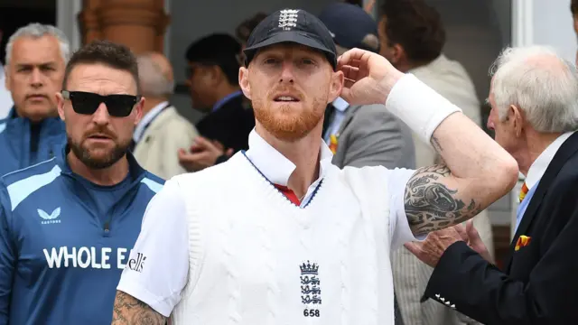 Ben Stokes, in England whites, pictured next to Brendon McCullum