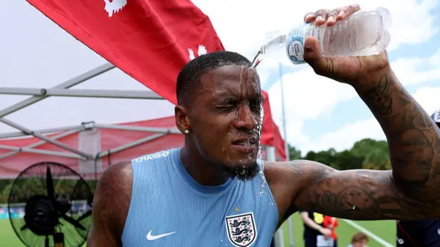 Ezri Konsa pouring water over face