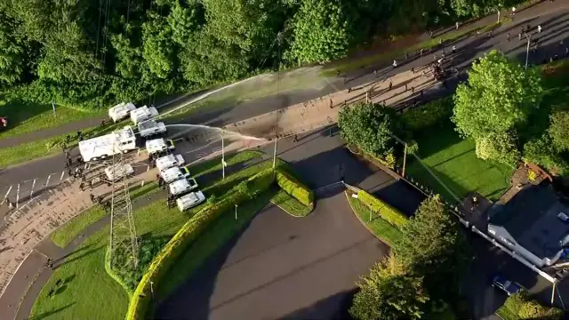 Water cannons firing at crowd