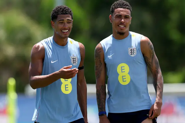 Morgan Rogers and Jude Bellingham wearing England branded vests