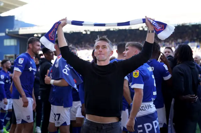 Ipswich Town manager Kieran McKenna celebrates promotion to The Championship on the pitch after the Sky Bet League One match at Portman Road, Ipswich.