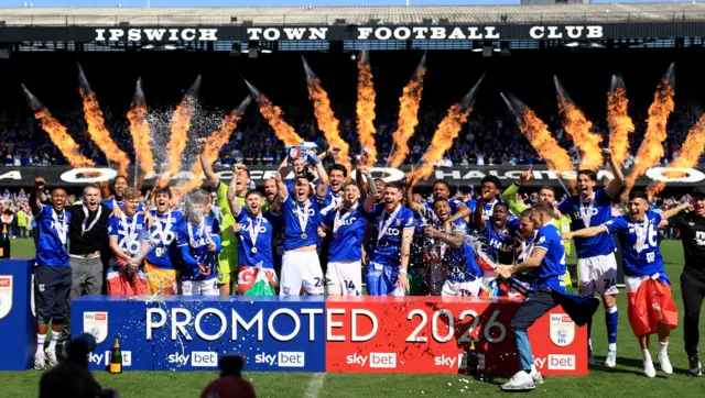 Ipswich Town's players celebrate securing promotion on the pitch after the Sky Bet Championship match at Portman Road, Ipswich.