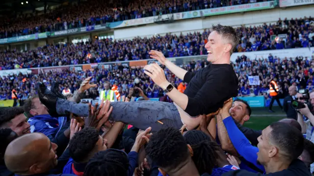 Ipswich Town manager Kieran McKenna is thrown into the air by the players as they celebrate promotion to The Championship on the pitch after the Sky Bet League One match at Portman Road, Ipswich.