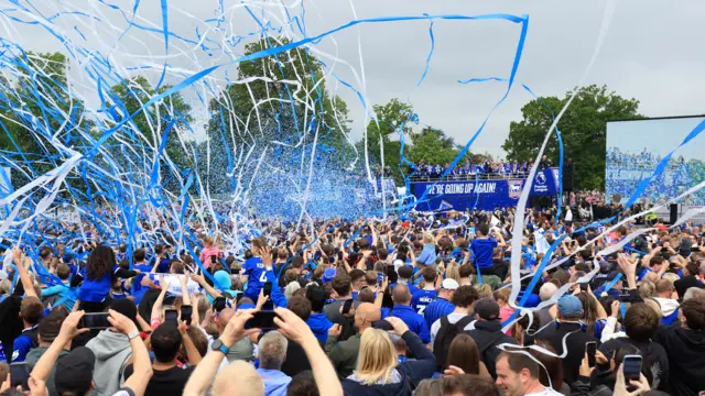 Streamers are set off as the Ipswich Town team bus passes during a victory parade in Ipswich. Ipswich Town clinched promotion back to the Premier League following a 3-0 victory over QPR at Portman Road