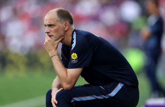 Thomas Tuchel sits down and has his hand over his mouth