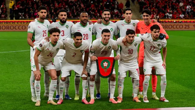 The Moroccan national team pose for a group photo ahead of the final match between Morocco and Senegal at Prince Moulay Abdellah Stadium in Rabat on January 18 2026