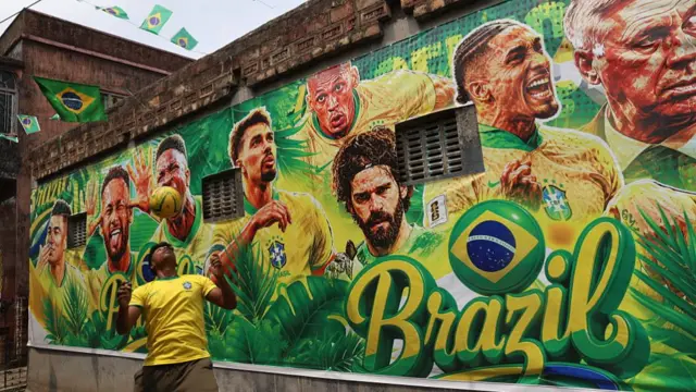lane is adorned with giant flex banners of Brazil football stars and national flags in Howrah, near Kolkata, on June 10, 2026, as fans prepare for the start of the FIFA World Cup 2026.